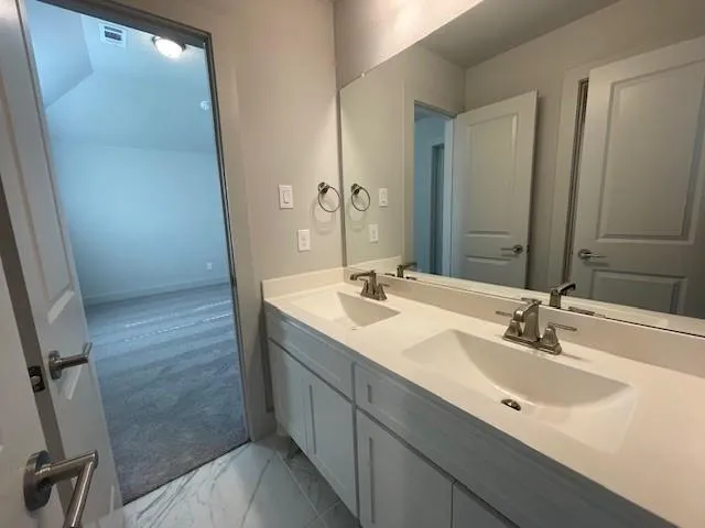 a bathroom with a bathtub and a toilet