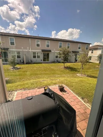 a view of a swimming pool with chairs