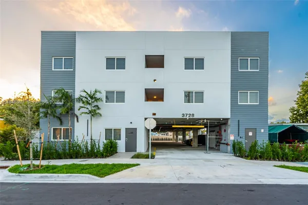 a view of a building with a sitting area