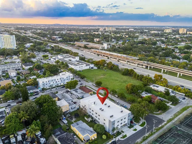an aerial view of residential building and ocean view