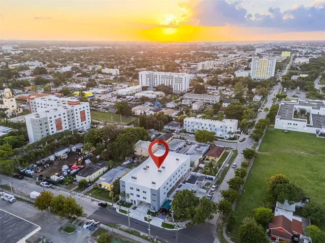 an aerial view of residential building and parking space