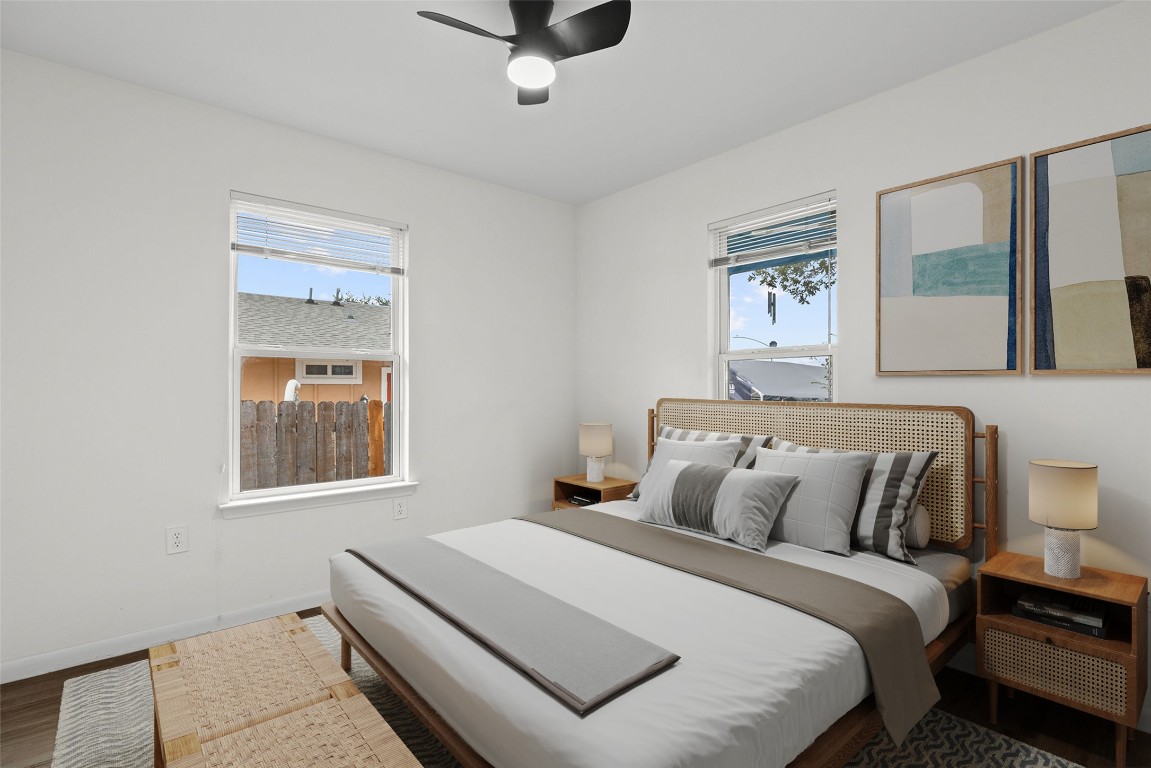 6110 Devonshire Cove Austin, TX 78723 - Photo 19 of 31 a bedroom with a bed and a window