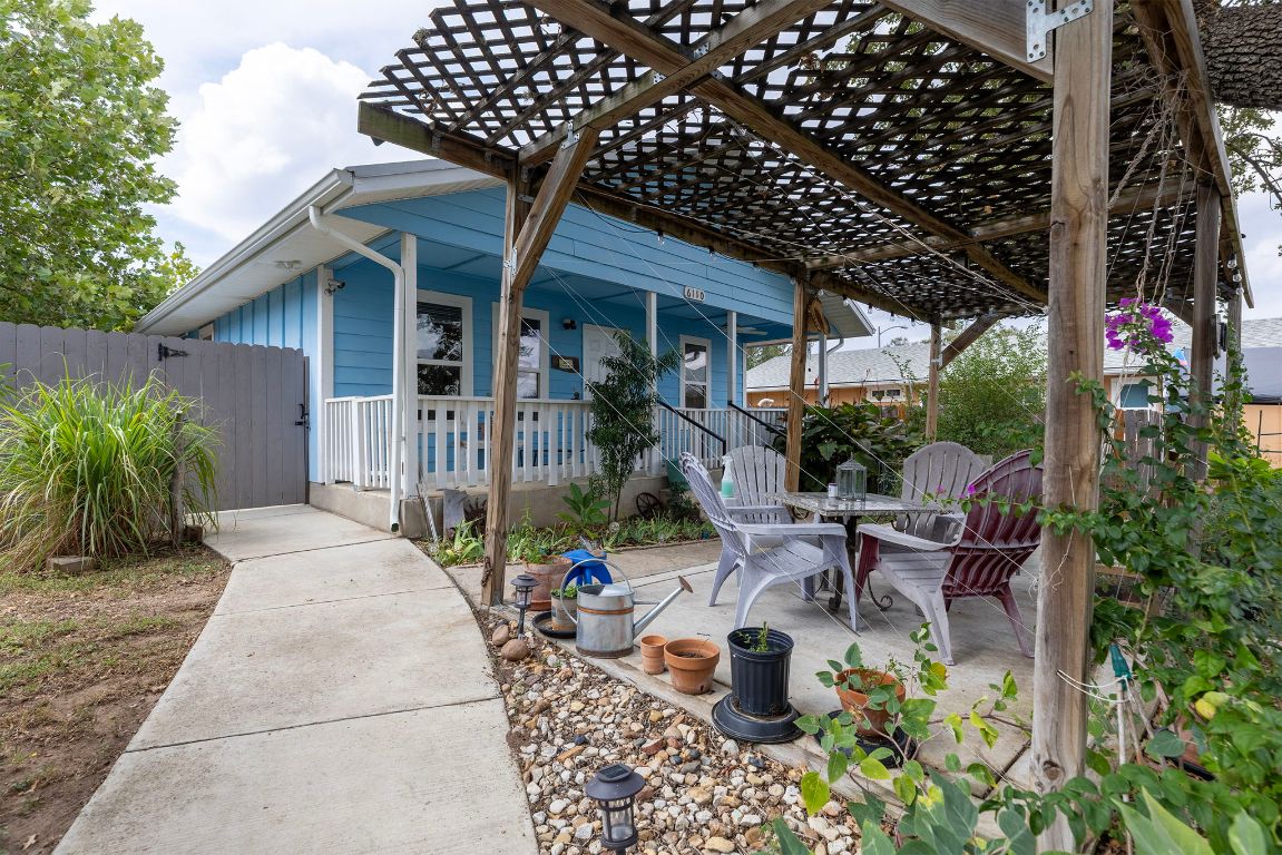 6110 Devonshire Cove Austin, TX 78723 - Photo 2 of 31 a view of a chair and table in backyard of the house
