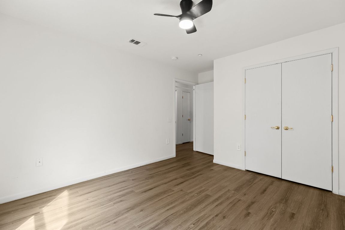 6110 Devonshire Cove Austin, TX 78723 - Photo 23 of 31 a view of a room with wooden floor