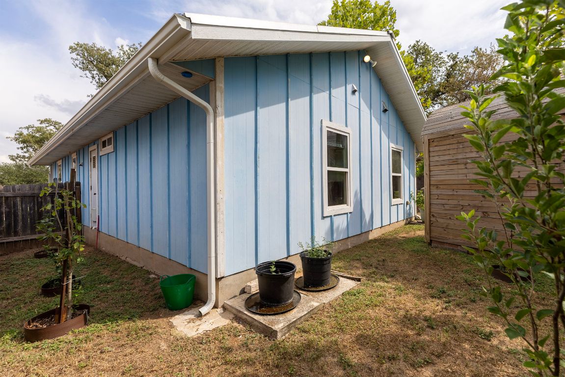 6110 Devonshire Cove Austin, TX 78723 - Photo 31 of 31 a house with tall trees in the background