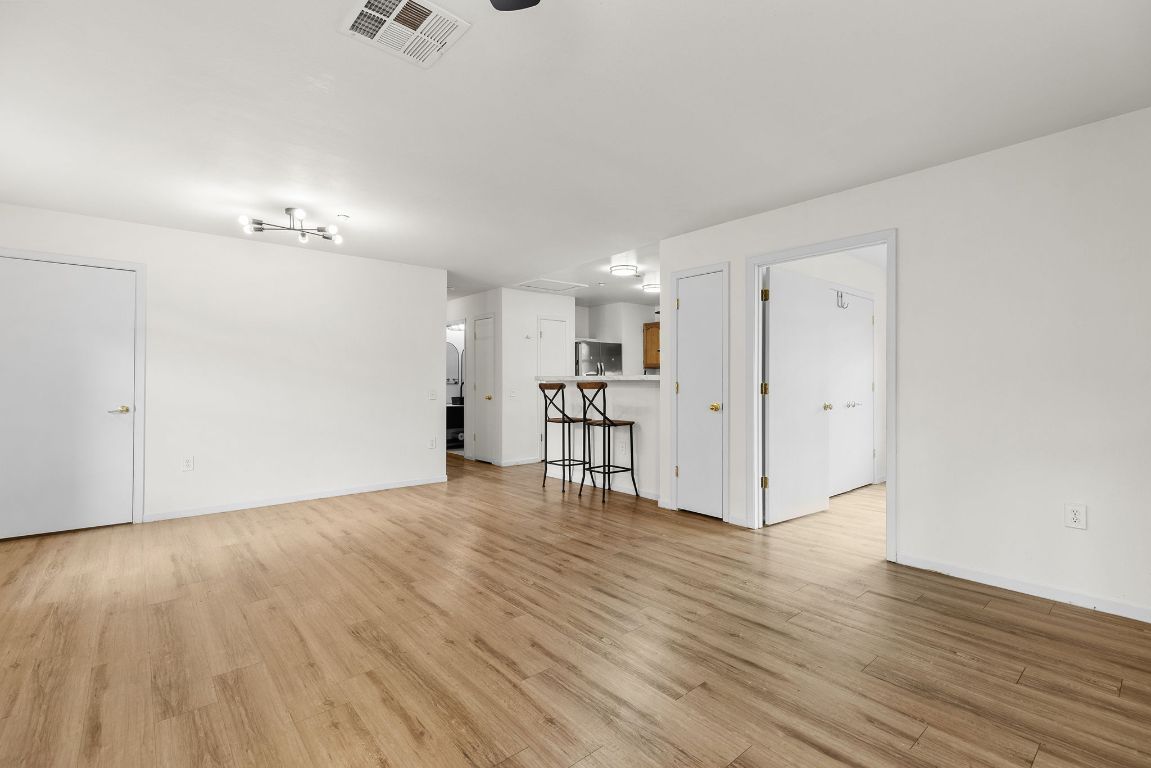 6110 Devonshire Cove Austin, TX 78723 - Photo 8 of 31 a view of empty room with wooden floor