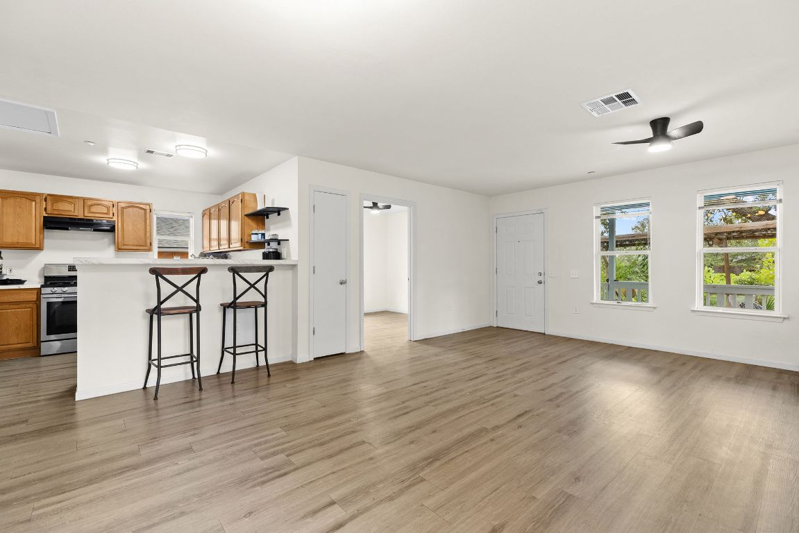 6110 Devonshire Cove Austin, TX 78723 - Photo 10 of 31 a view of kitchen with furniture and wooden floor