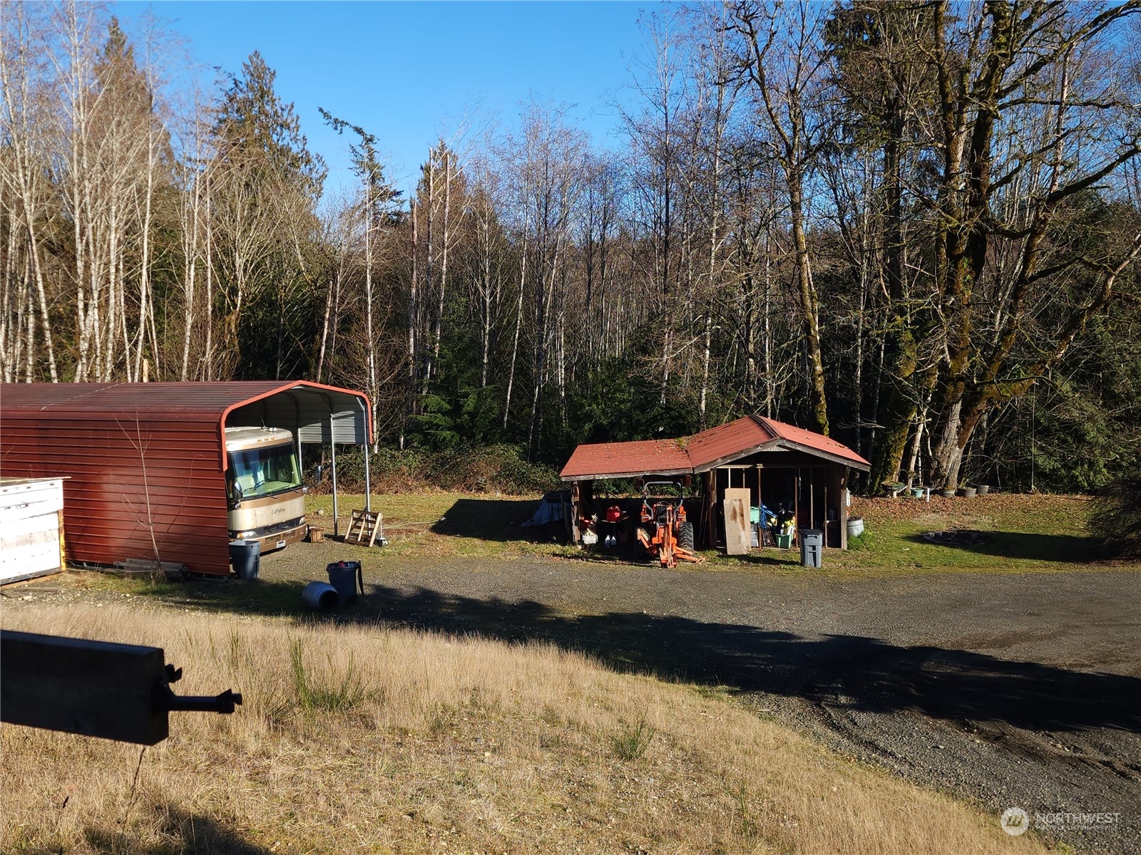 0 Silver Lane Southwest Port Orchard, WA 98367 - Photo 7 of 9 a view of a house with a yard patio and fire pit