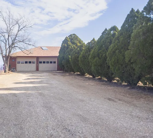 a view of large building with mountain in background