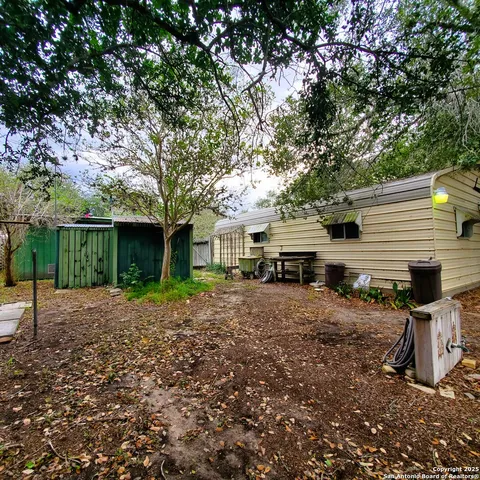 a view of a yard with a trees
