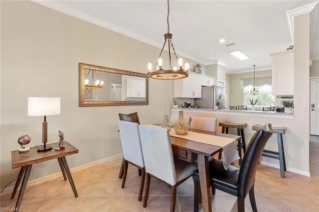 a bedroom with bed and a large window