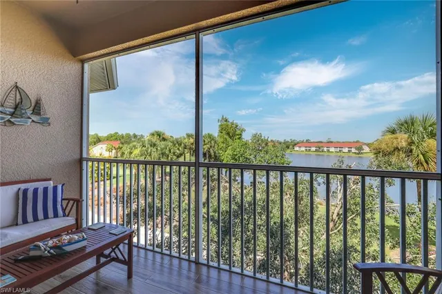 a view of a balcony with furniture