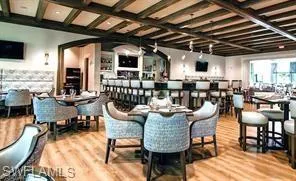 a living room with lots of furniture and a large window