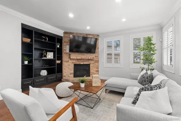 a living room with furniture fireplace and a flat screen tv