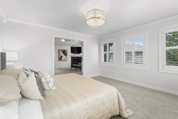 a bedroom with a large bed and a window