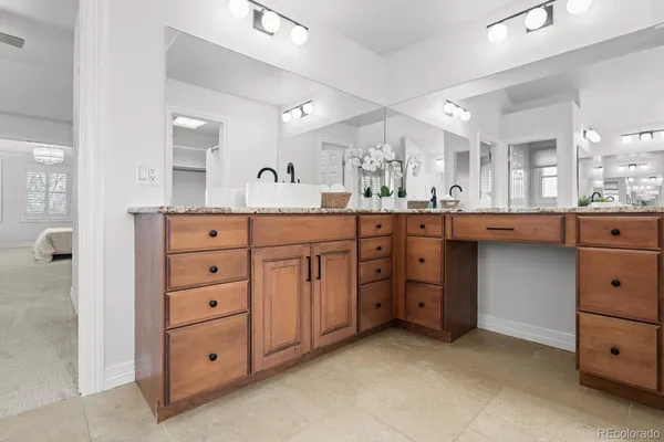 a kitchen with cabinets appliances and a window
