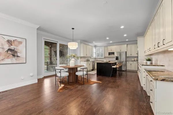 a large open kitchen with a table and chairs
