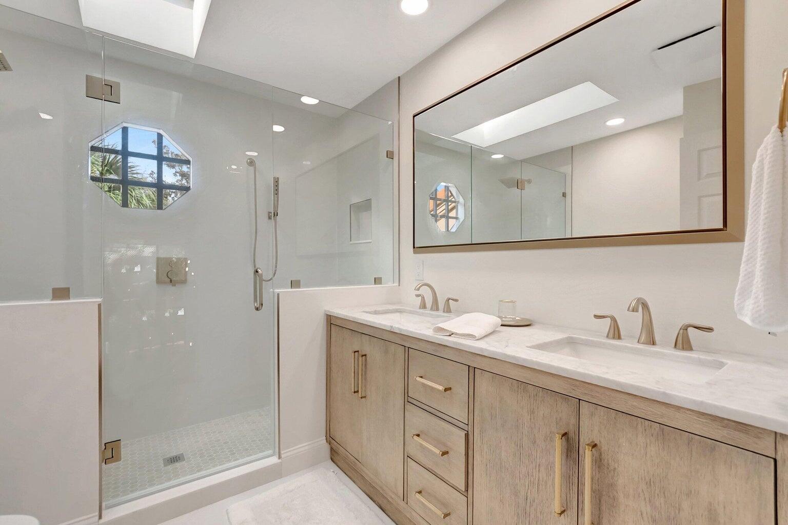 22728 Caravelle Circle Boca Raton, FL 33433 - Photo 15 of 39 a bathroom with double sink and a mirror