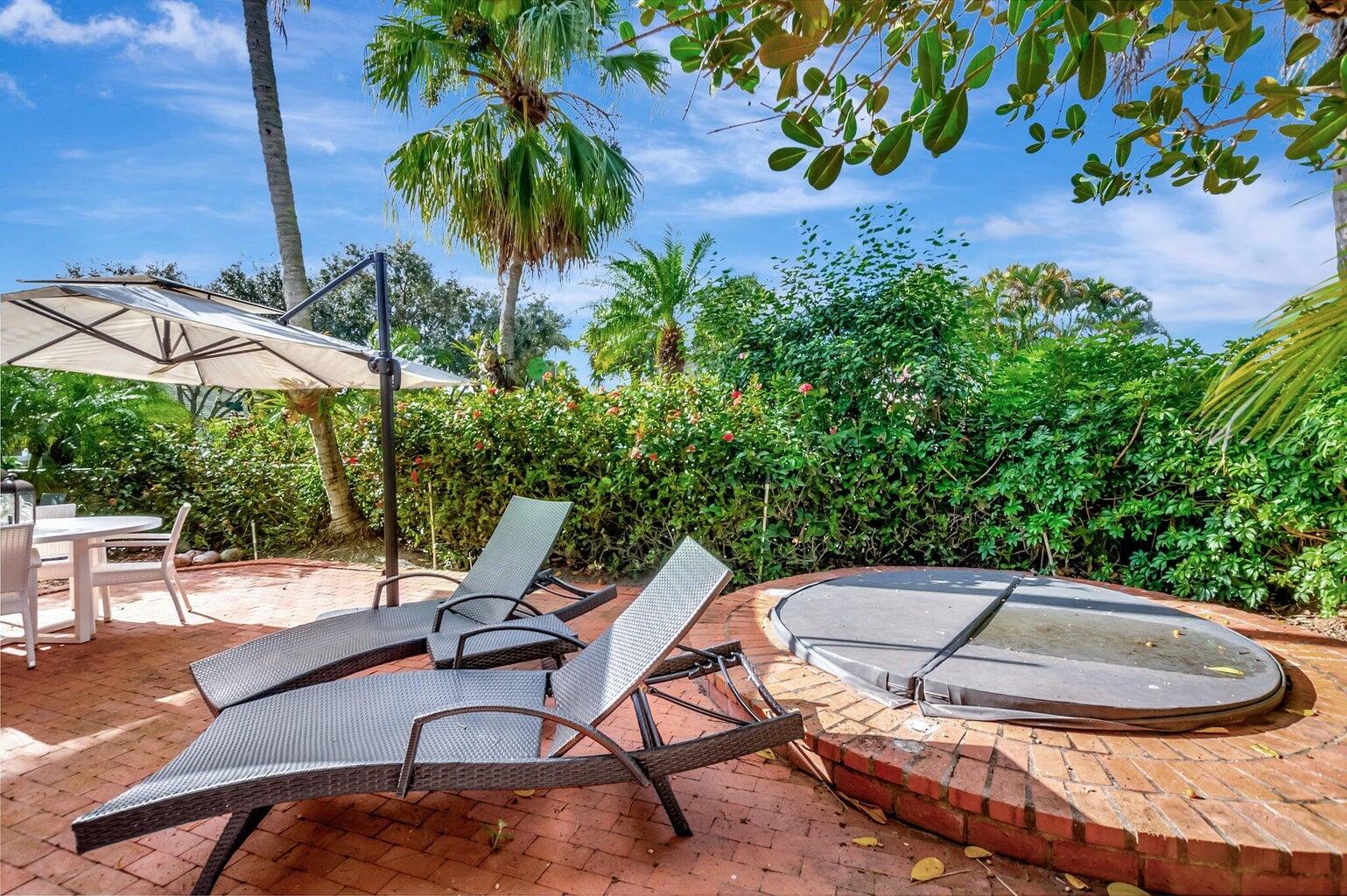 22728 Caravelle Circle Boca Raton, FL 33433 - Photo 16 of 39 a view of a backyard with a patio and plants