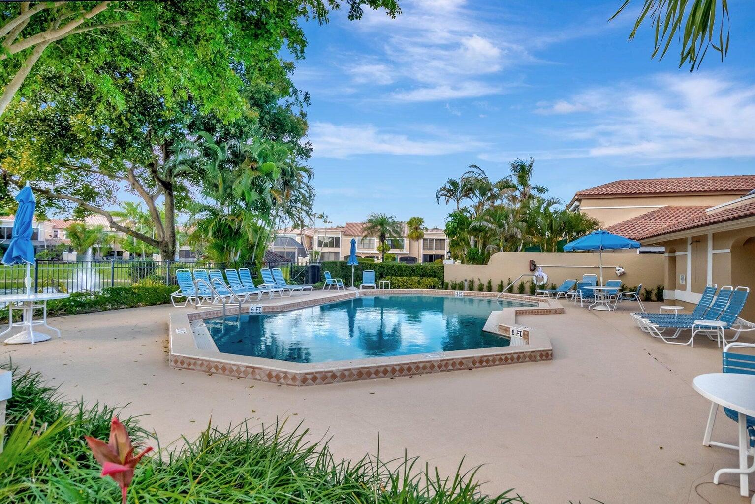22728 Caravelle Circle Boca Raton, FL 33433 - Photo 19 of 39 a view of swimming pool with outdoor seating and plants