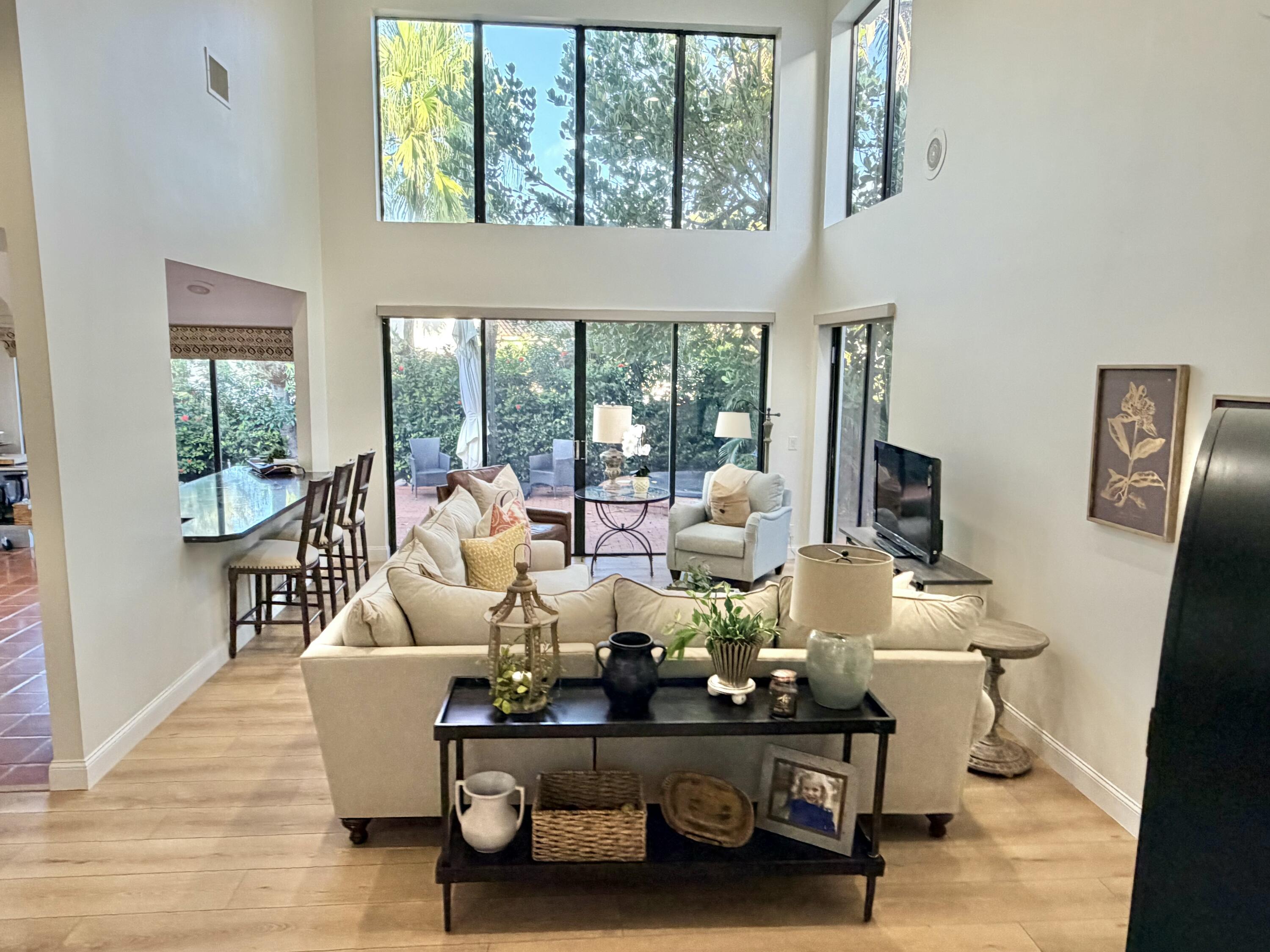 22728 Caravelle Circle Boca Raton, FL 33433 - Photo 24 of 39 a living room with furniture and a large window
