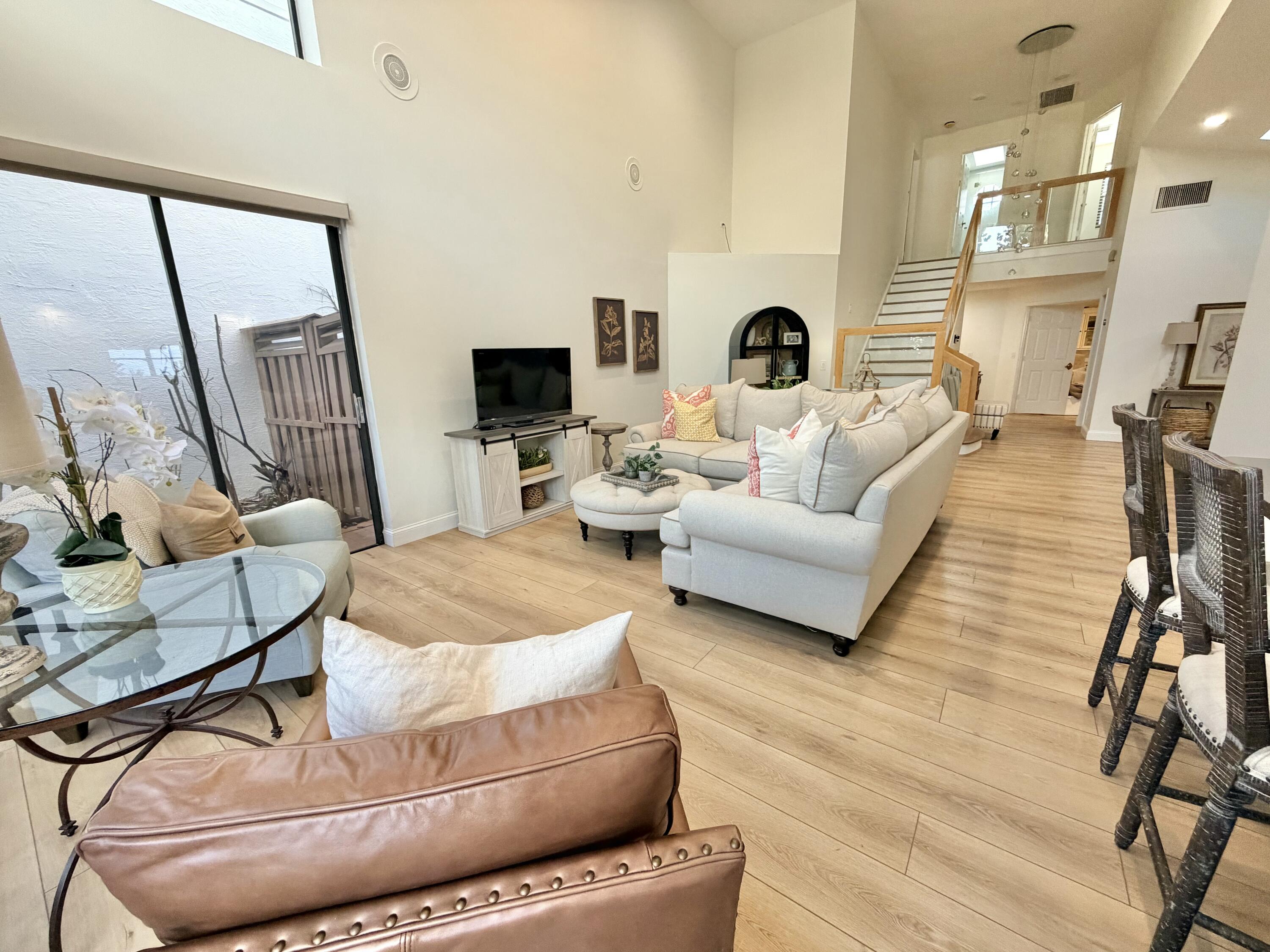22728 Caravelle Circle Boca Raton, FL 33433 - Photo 26 of 39 a living room with furniture and a fireplace