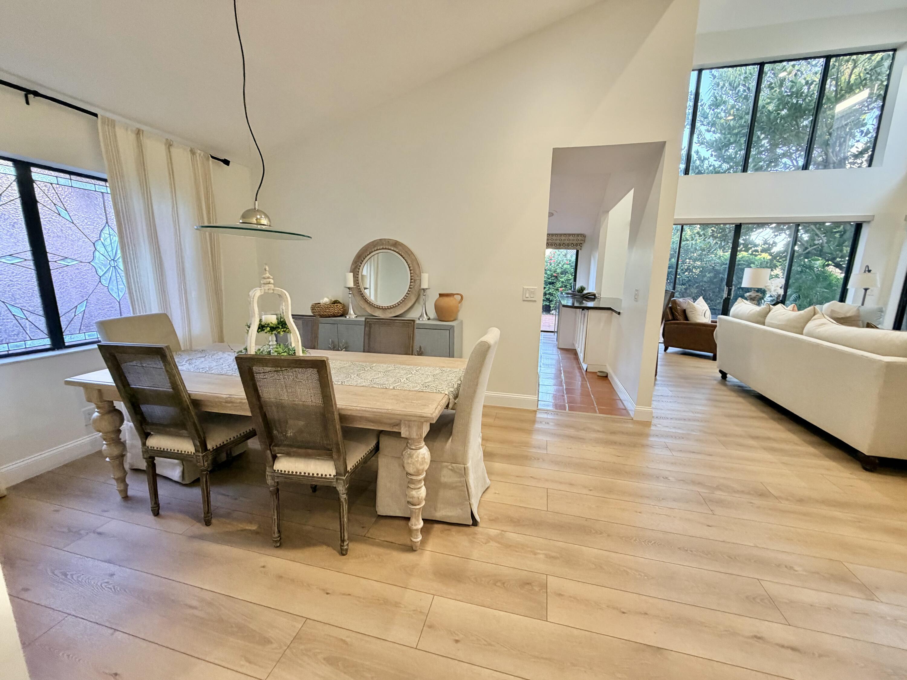 22728 Caravelle Circle Boca Raton, FL 33433 - Photo 27 of 39 a view of a dining room with furniture window and wooden floor