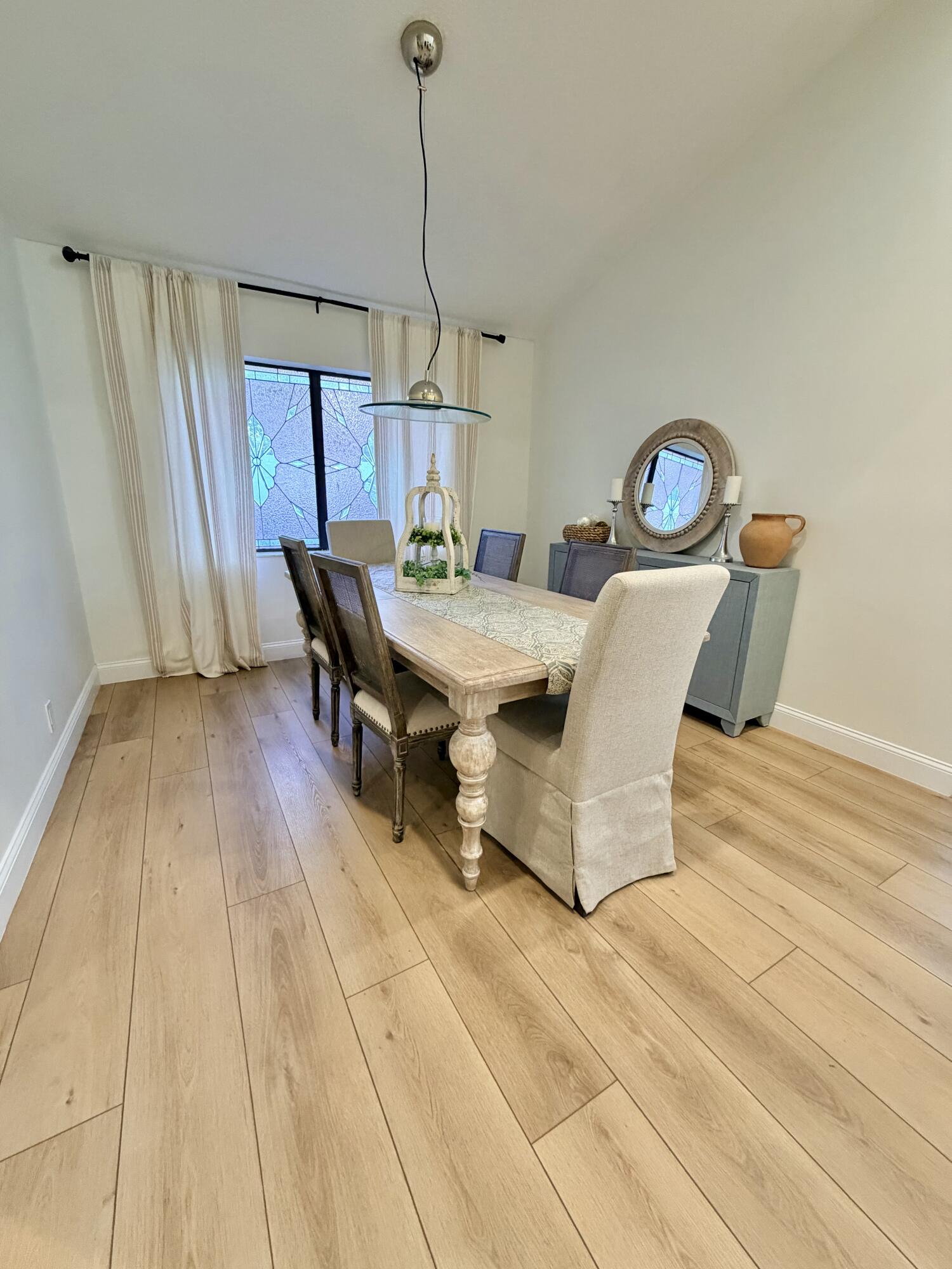 22728 Caravelle Circle Boca Raton, FL 33433 - Photo 28 of 39 a dining room with a table and chairs