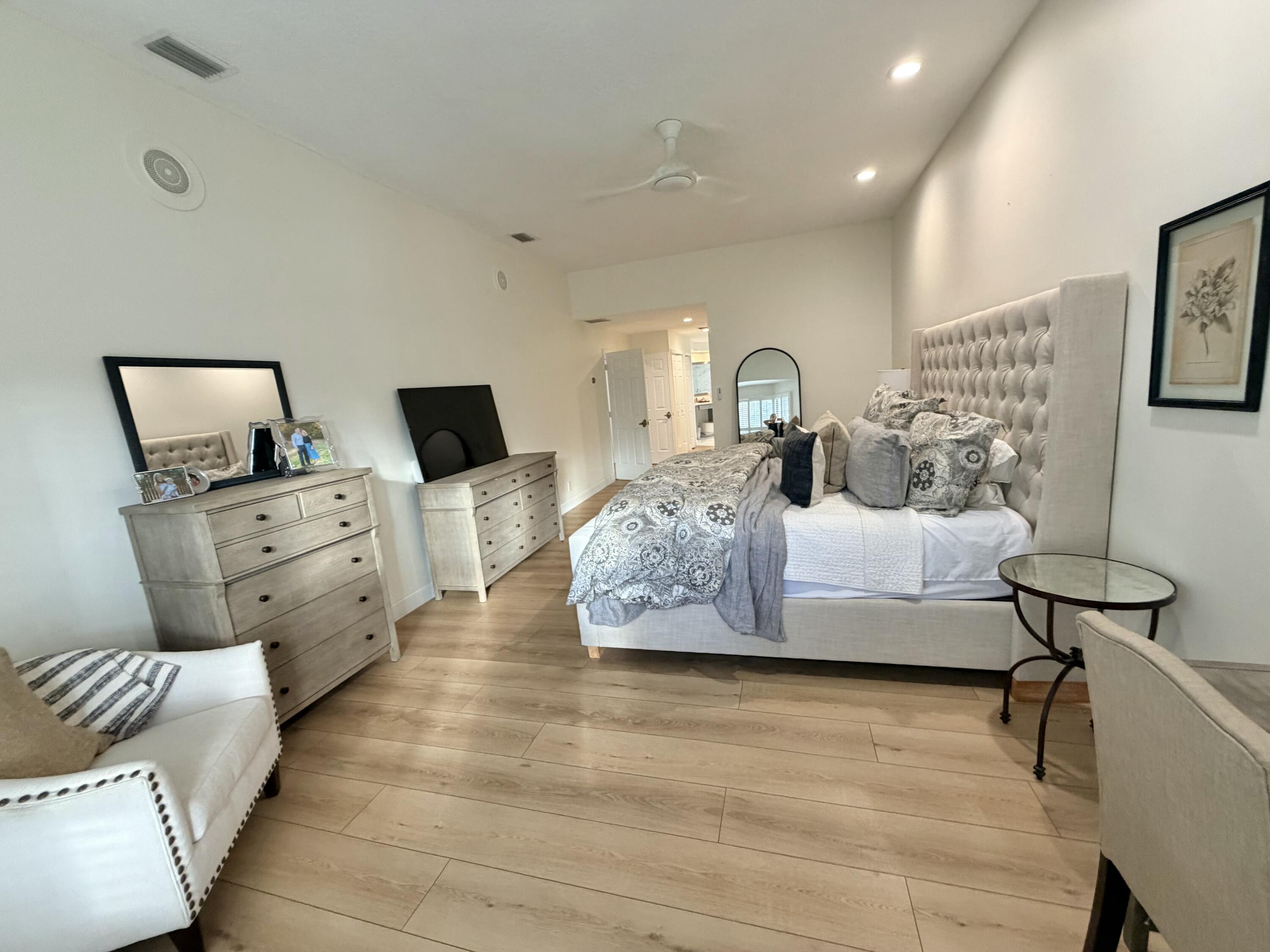 22728 Caravelle Circle Boca Raton, FL 33433 - Photo 36 of 39 a living room with furniture and a flat screen tv