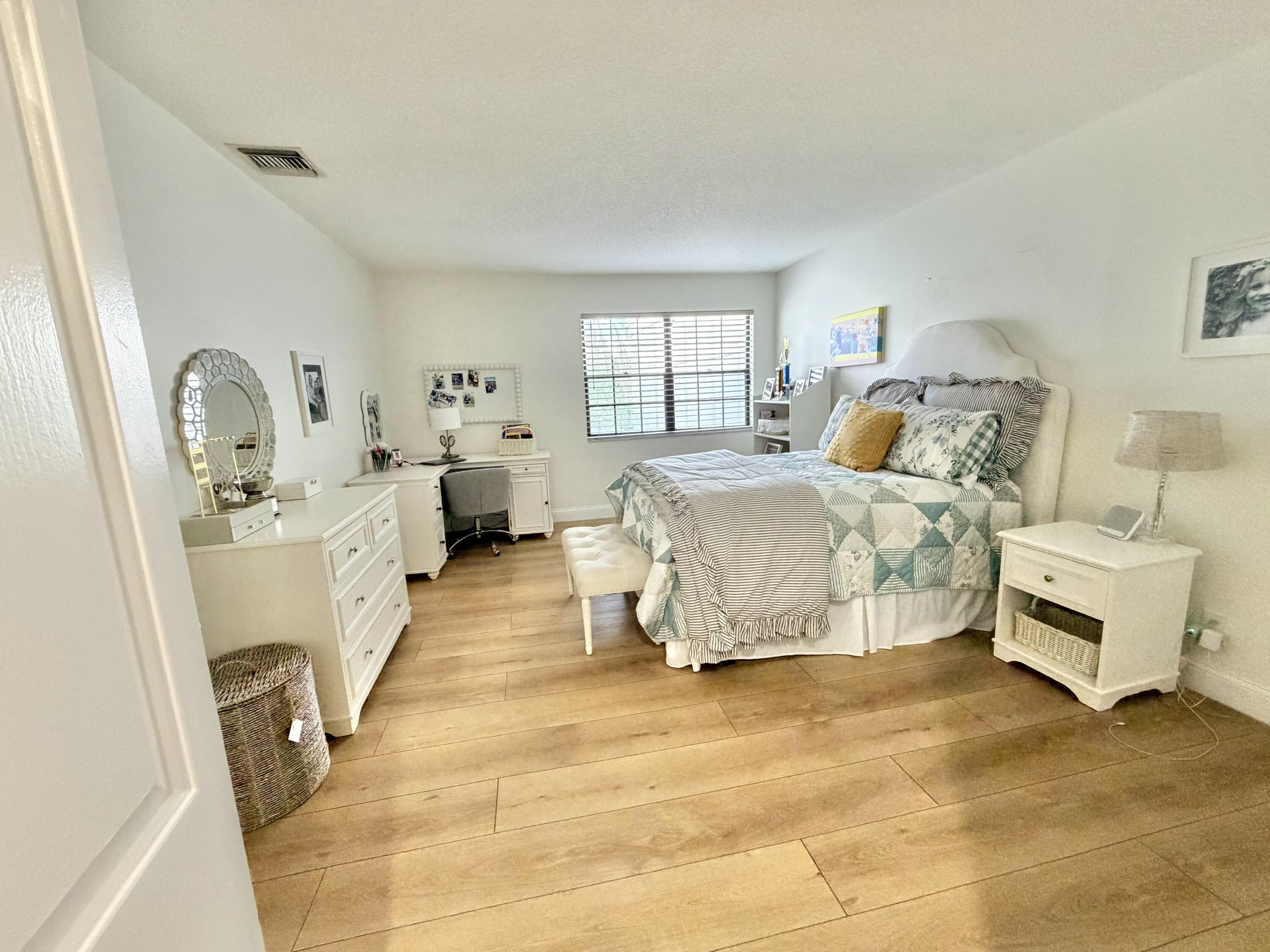 22728 Caravelle Circle Boca Raton, FL 33433 - Photo 39 of 39 a bed room with a bed and furniture