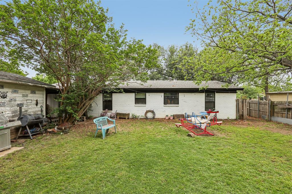 426 West Lake Street Krum, TX 76249 - Photo 16 of 16 a backyard of a house with seating space