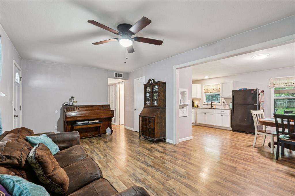 426 West Lake Street Krum, TX 76249 - Photo 4 of 16 a living room with furniture and a piano table