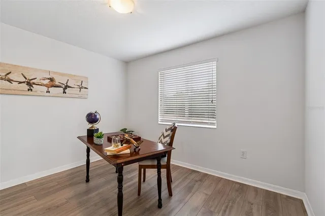 a reading room with furniture and wooden floor