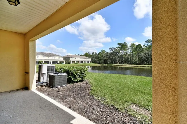 a view of a back yard from a balcony