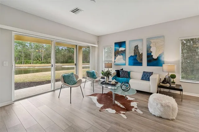 a living room with furniture and a large window