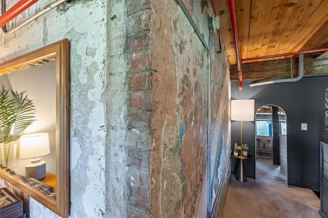 a bedroom with a large bed and a balcony