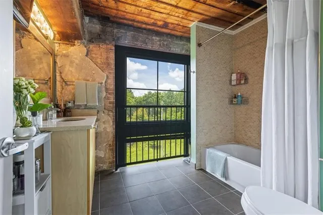 a view of a kitchen with a sink and dishwasher