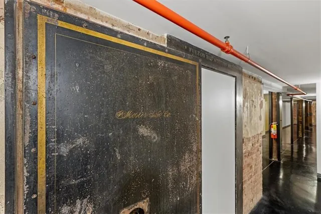 a view of a lake with a bench and a bench next to a road