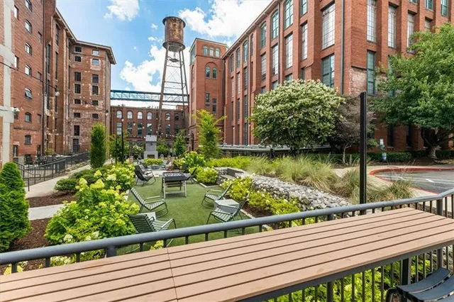 a view of a balcony with wooden floor