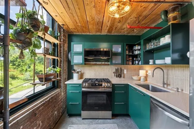 a kitchen with a sink and a stove top oven