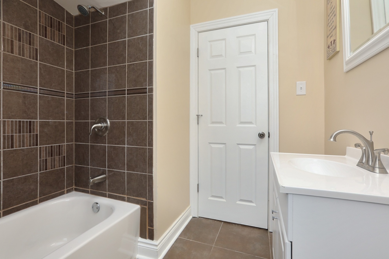 10217 South Prairie Avenue Chicago, IL 60628 - Photo 12 of 23 a bathroom with a bathtub and a sink