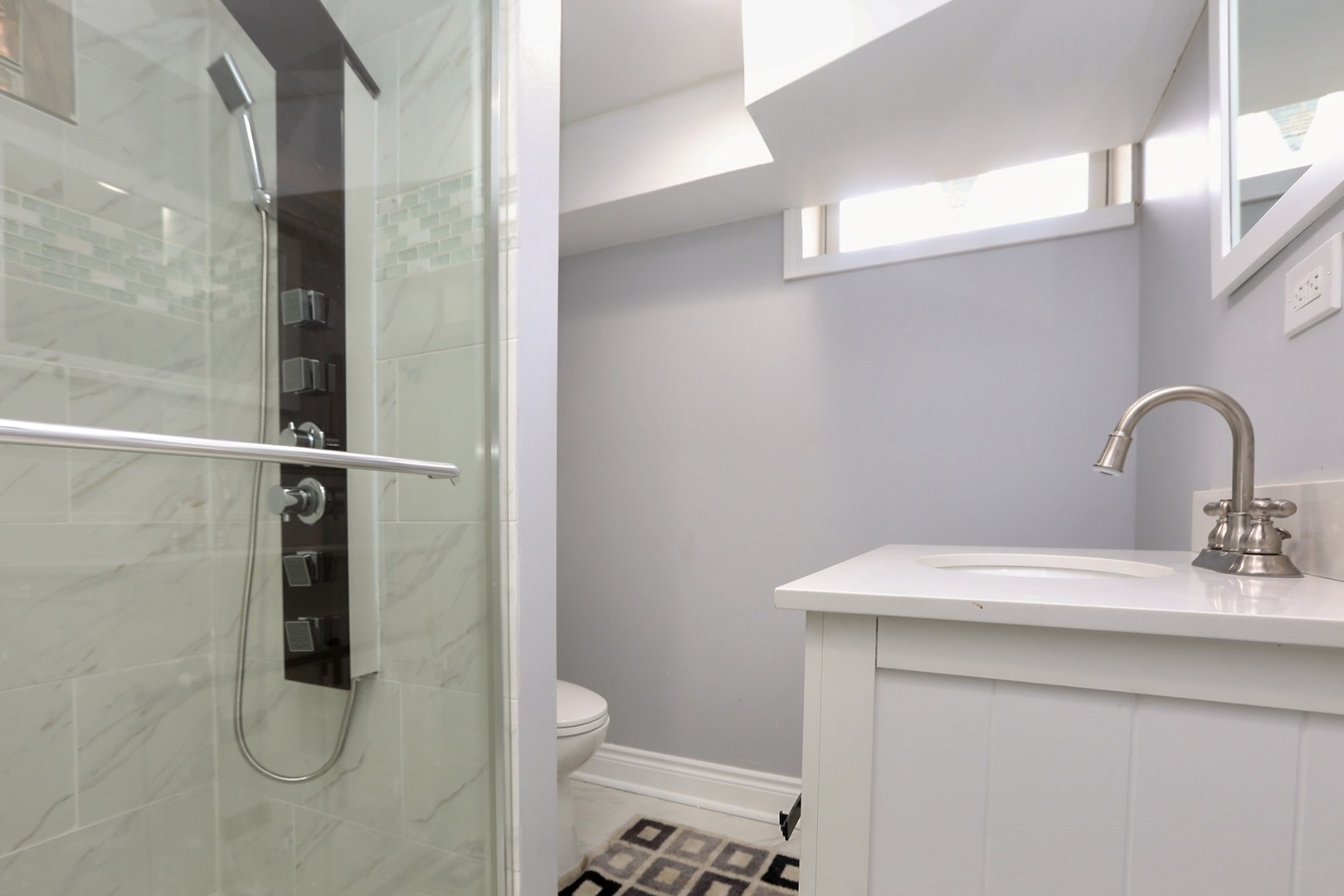 10217 South Prairie Avenue Chicago, IL 60628 - Photo 13 of 23 a bathroom with a sink toilet and shower