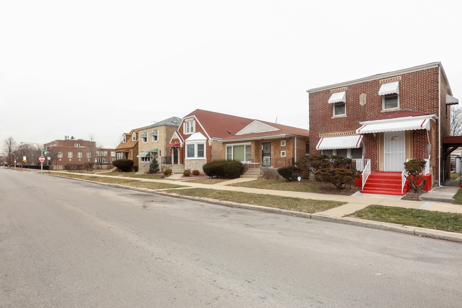 10217 South Prairie Avenue Chicago, IL 60628 - Photo 20 of 23 a front view of a building with street