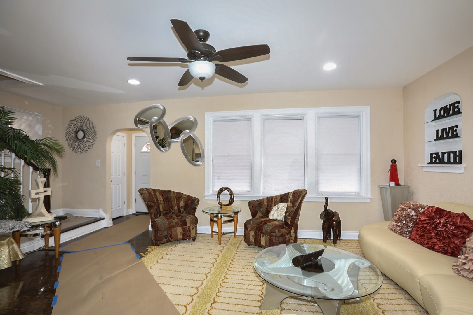 10217 South Prairie Avenue Chicago, IL 60628 - Photo 3 of 23 a living room with furniture and a large window