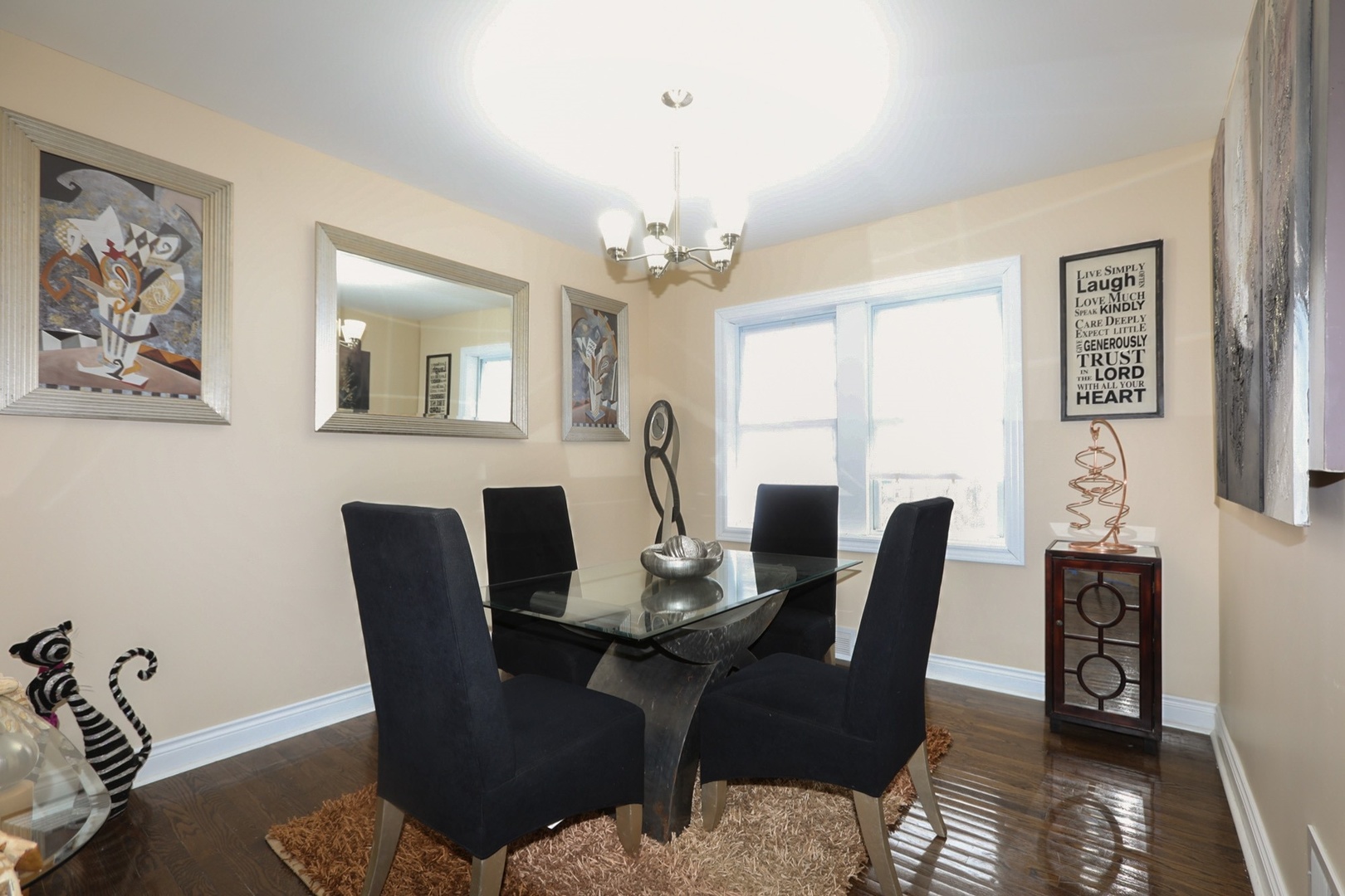 10217 South Prairie Avenue Chicago, IL 60628 - Photo 7 of 23 a view of a dining room with furniture window and wooden floor