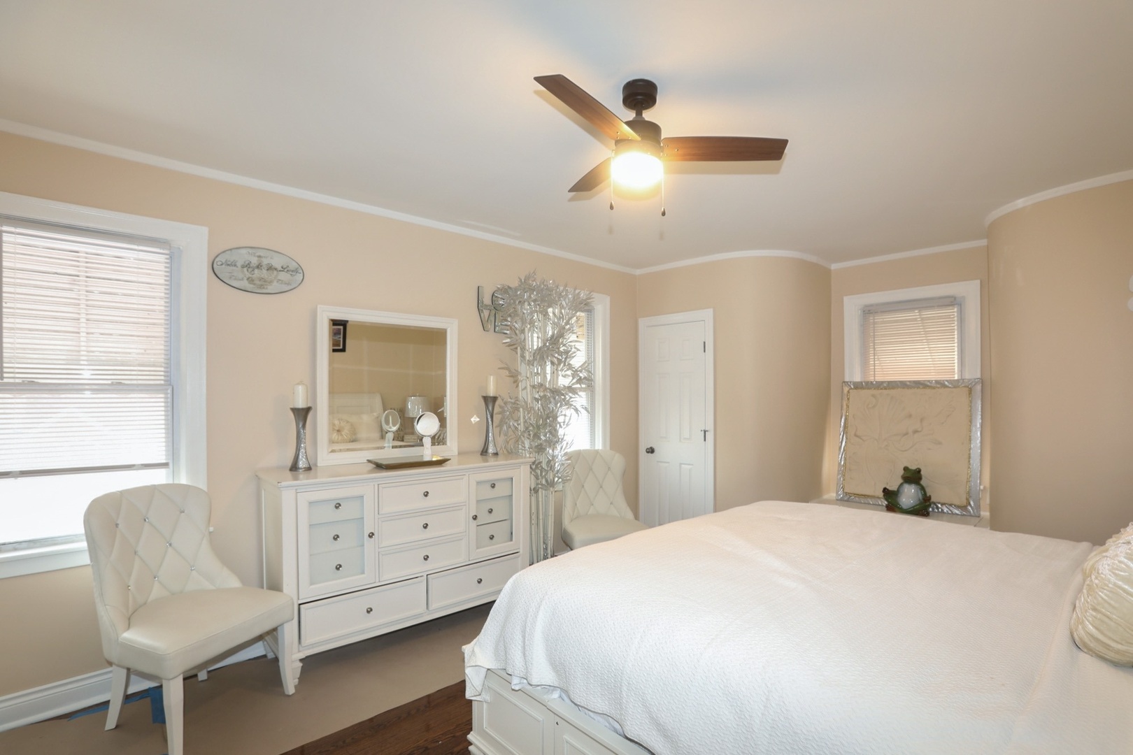 10217 South Prairie Avenue Chicago, IL 60628 - Photo 8 of 23 a bedroom with a bed and chair