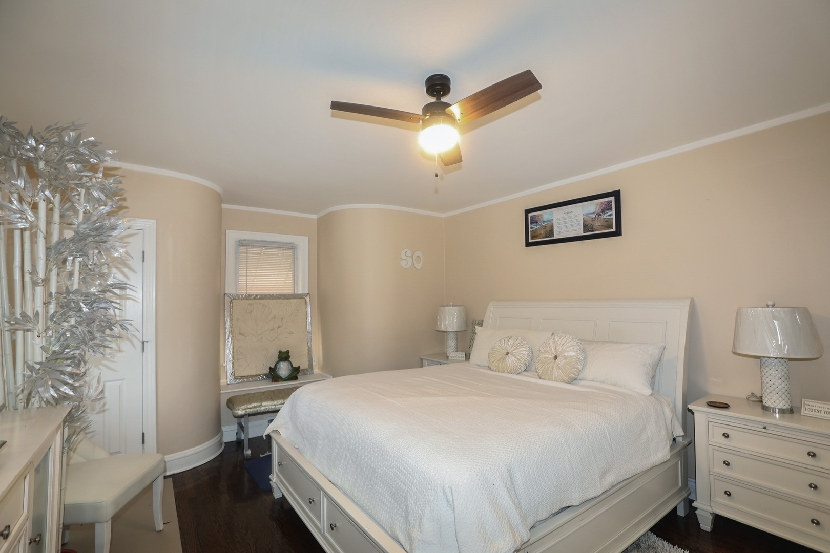 10217 South Prairie Avenue Chicago, IL 60628 - Photo 9 of 23 a bedroom with a bed and a table
