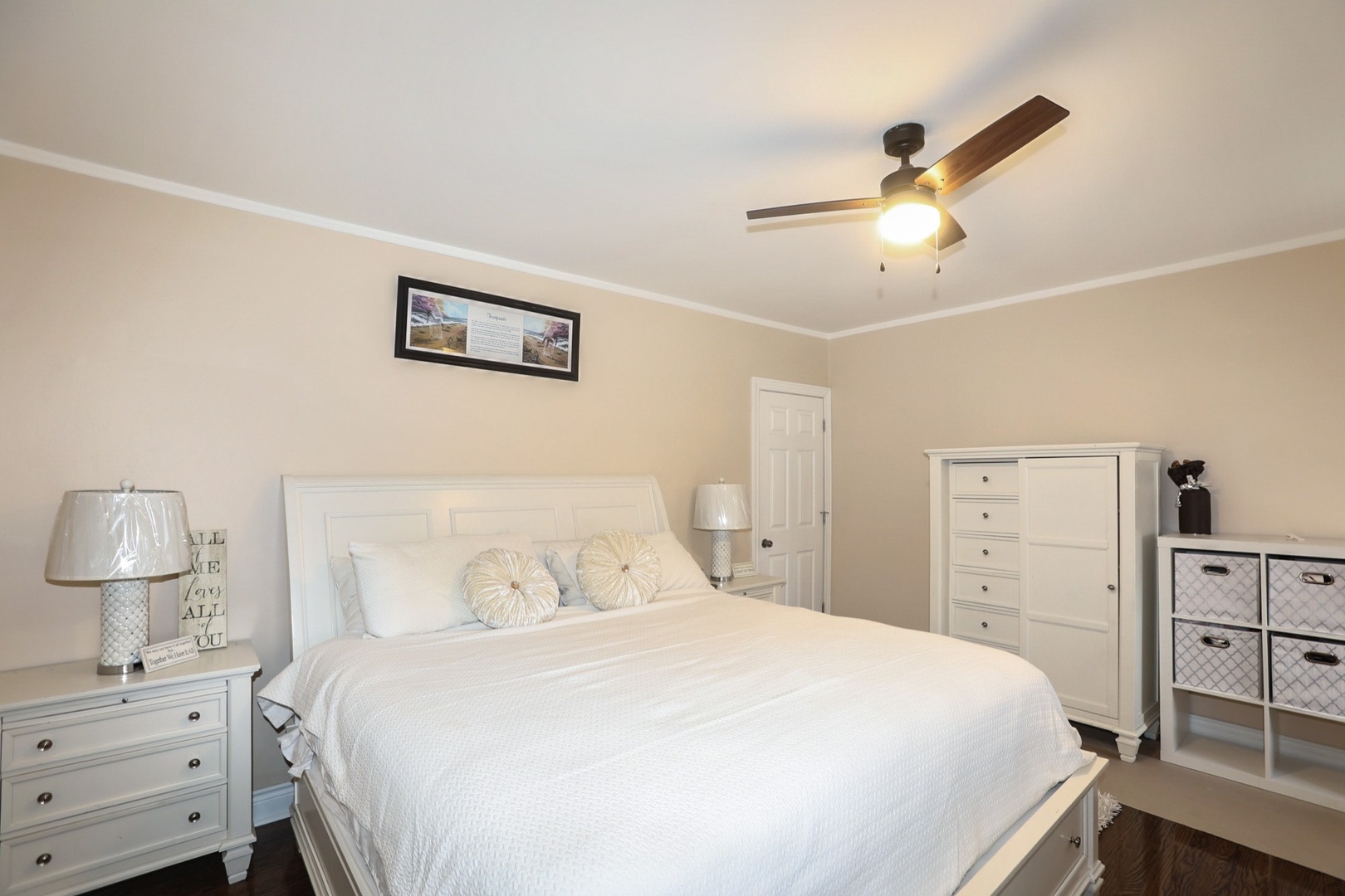 10217 South Prairie Avenue Chicago, IL 60628 - Photo 10 of 23 a bedroom with a bed and a lamp on the dresser