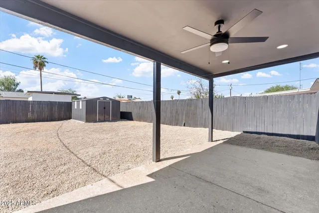 a view of a hall with a ceiling fan