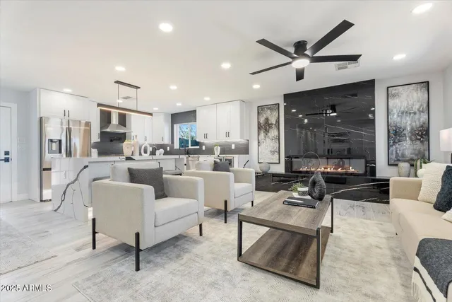 a living room with furniture and a large window